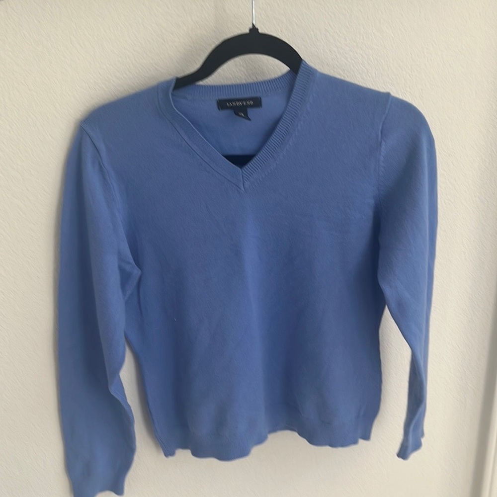 A super cute blue v neck sweater! Size x small